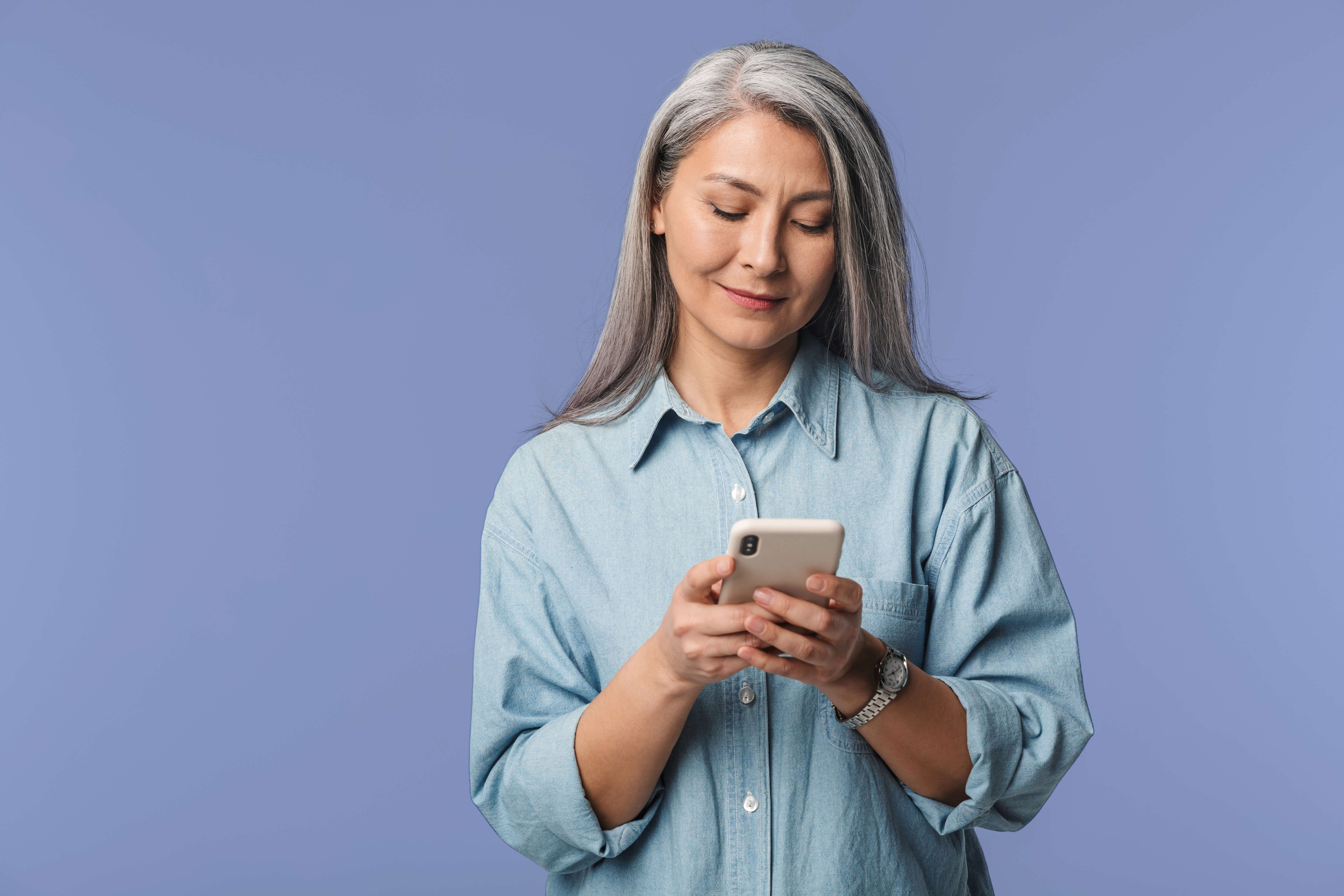 Woman using phone indoors 2